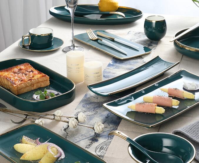 Green ceramic dining utensils, coffee cups and saucers