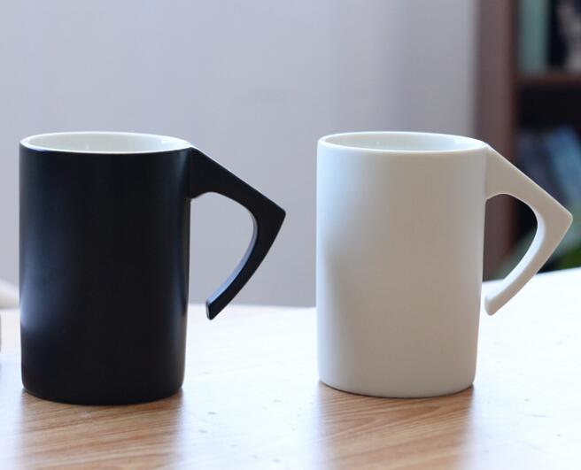 Ceramic mouthwash mugs in hotel bathroom